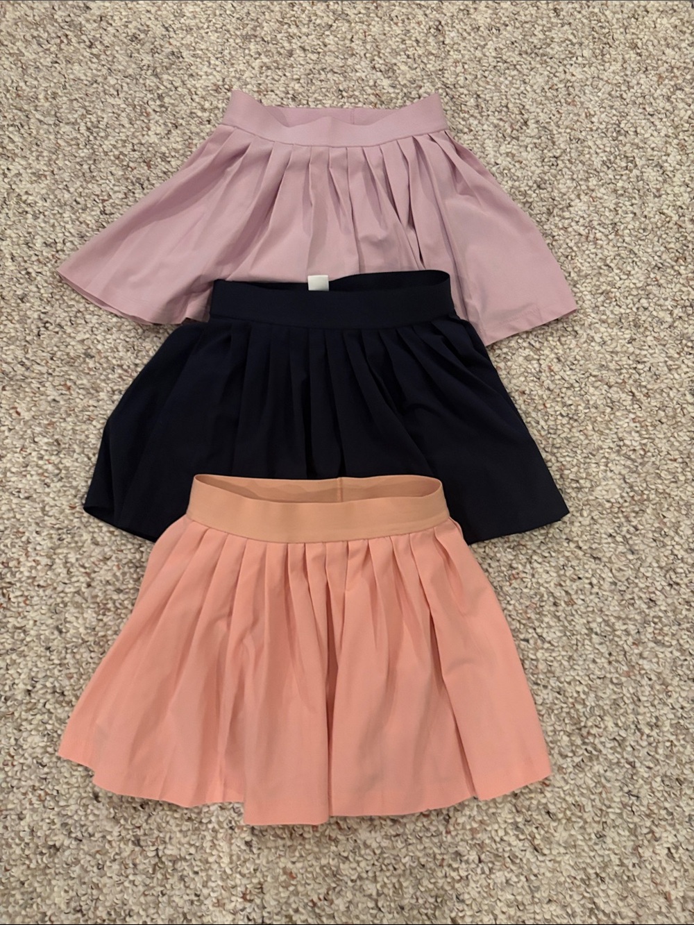Athleta skorts 3 pairs size xsmall 6.  Lavender, peach and navy
